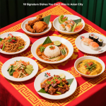 A table filled with signature Asian City dishes including sushi, Peking Duck, and Dim Sum