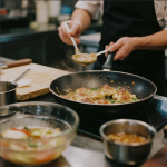 Chef preparing a new dish in the Asian City kitchen