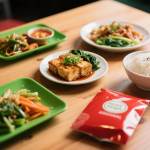 Assortment of vegetarian and vegan Asian dishes including tofu stir-fry, vegetable curry, and noodle soup